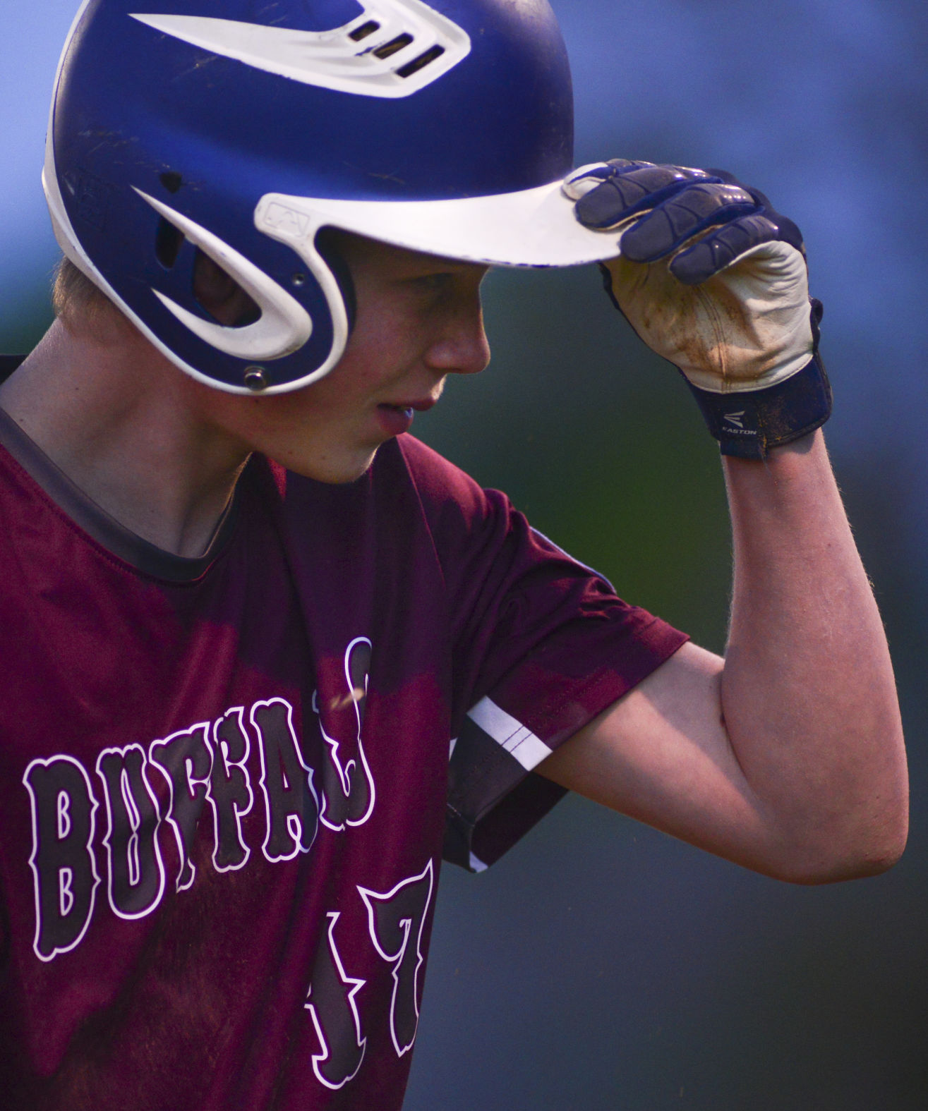 Lane Boden adjusts his helmet after getting tagged out on third base on Tuesday